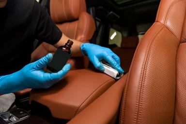Coated leather seating with a protected finish