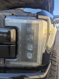 before shot of the headlight of a ford super duty